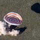 The Russian Soyuz space capsule, carrying U.S. astronaut Thomas Marshburn, Russian cosmonaut Roman Romanenko and Canadian astronaut Chris Hadfield, lands some 150 km (90 miles) southeast of the town of Dzhezkazgan in central Kazakhstan, Tuesday, May 14, 2013. The Soyuz space capsule carrying a three-man crew returning from a five-month mission to the International Space Station landed safely Tuesday on the steppes of Kazakhstan. (AP Photo/Sergei Remezov, Pool)